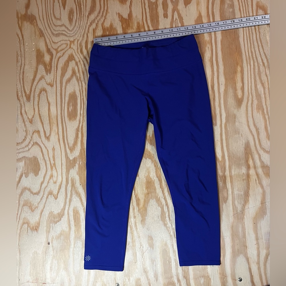 Athleta blue leggings with zipper back pocket. Size small